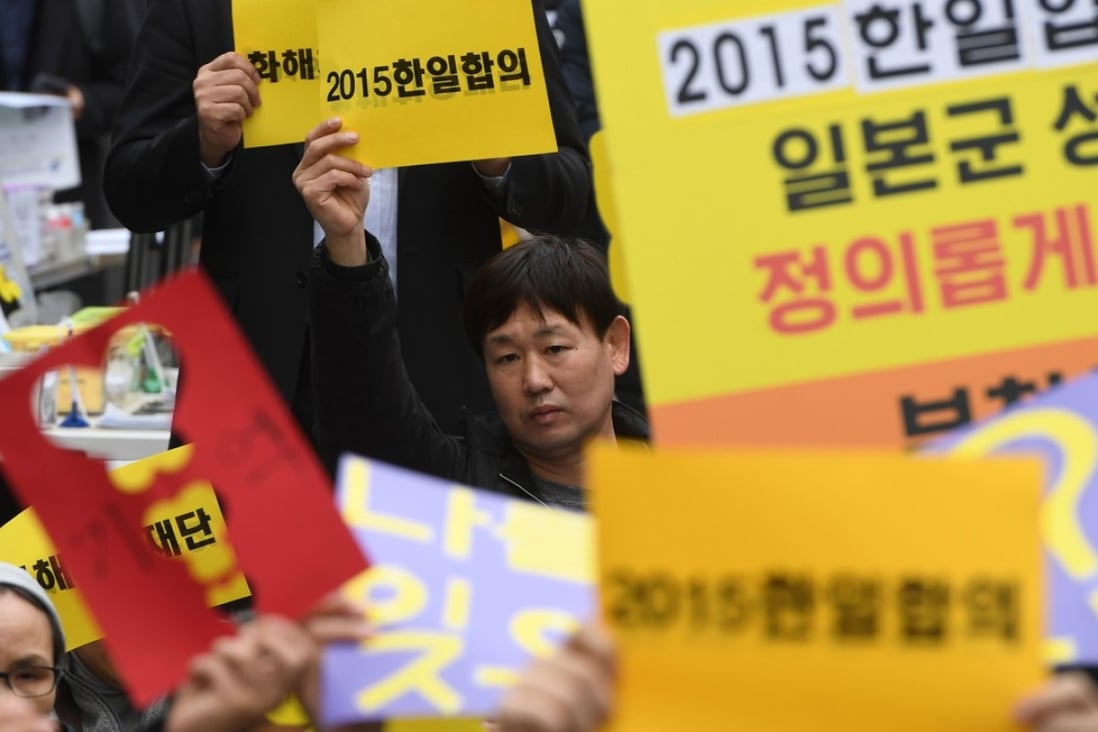 South Korean protesters hold up signs during a weekly anti-Japanese demonstration supporting “comfort women”, who served as sex slaves for Japanese soldiers during second world war, in front of the Japanese embassy in Seoul this month. The Japan Times said on Friday that it would no longer use the term ‘comfort women’. Photo: AFP