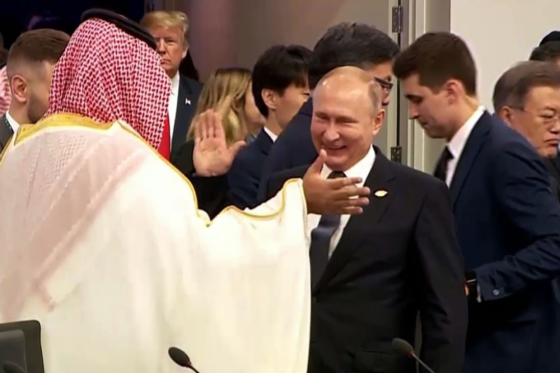 Russia's President Vladimir Putin, Centre, and Saudi Arabia's Crown Prince Mohammed bin Salman at the G20 Leaders' Summit in Buenos Aires, Argentina, on Friday as US President Donald Trump enters the room. Photo: AFP