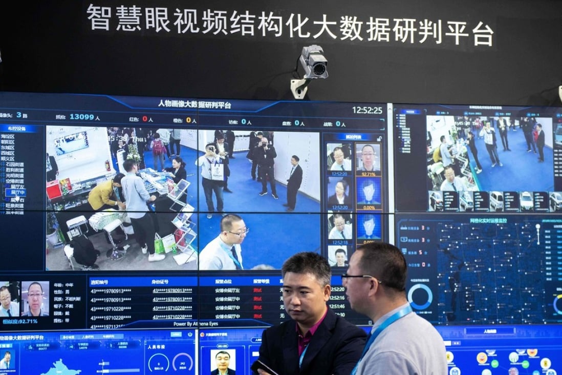 Visitors are filmed by AI security cameras using facial recognition technology at the 14th China International Exhibition on Public Safety and Security at the China International Exhibition Center in Beijing on October 24, 2018. Photo: AFP