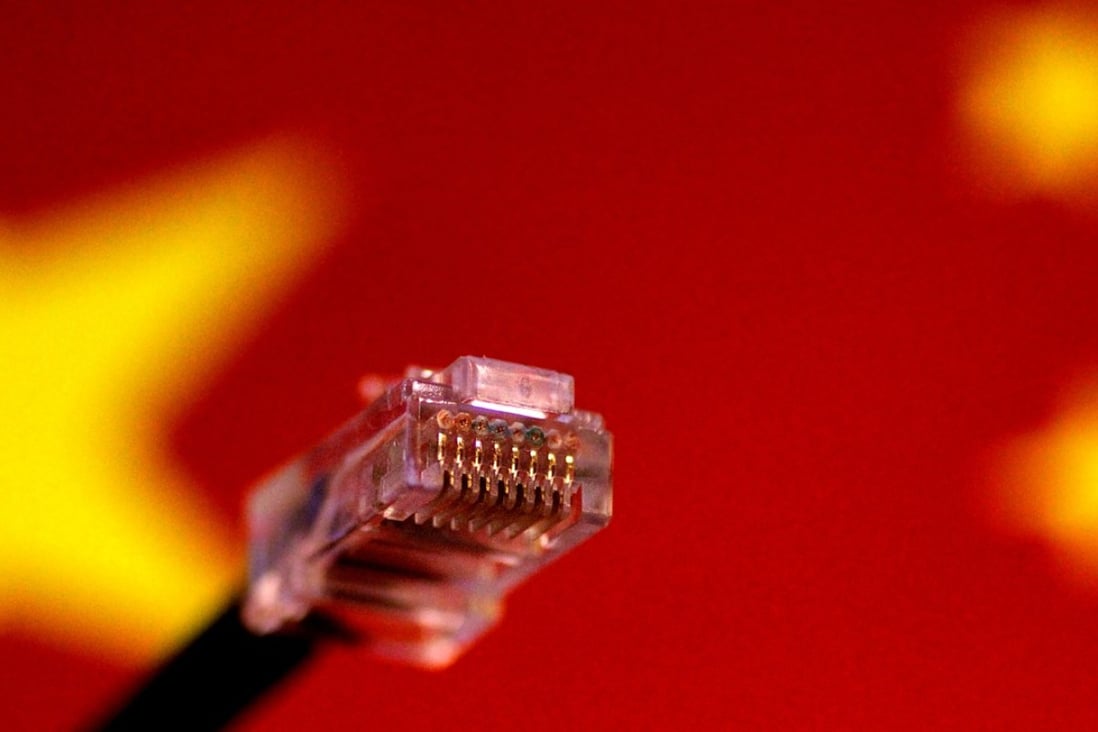 A computer network cable is seen above a Chinese flag. Photo: Reuters