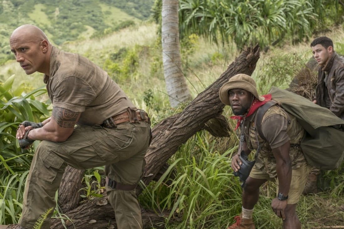 Dwayne Johnson, Kevin Hart (centre) and Nick Jonas in a still from Jumanji: Welcome to the Jungle.