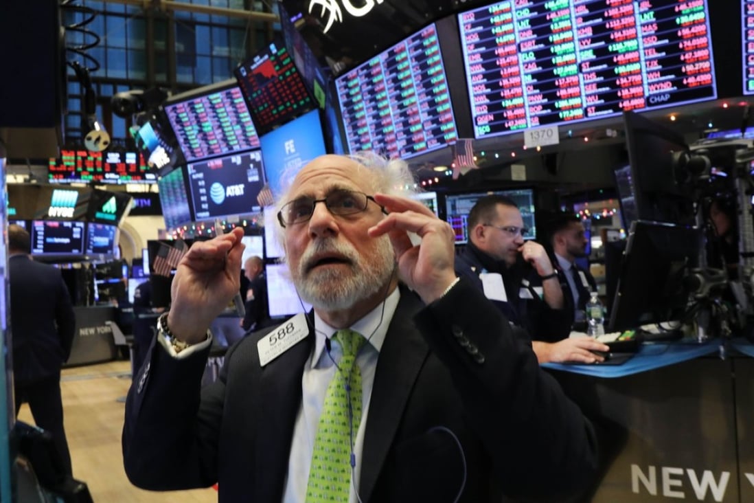 A trader works the floor of the New York Stock Exchange on Monday, when the Dow fell nearly 800 points. Photo: Getty Images/AFP