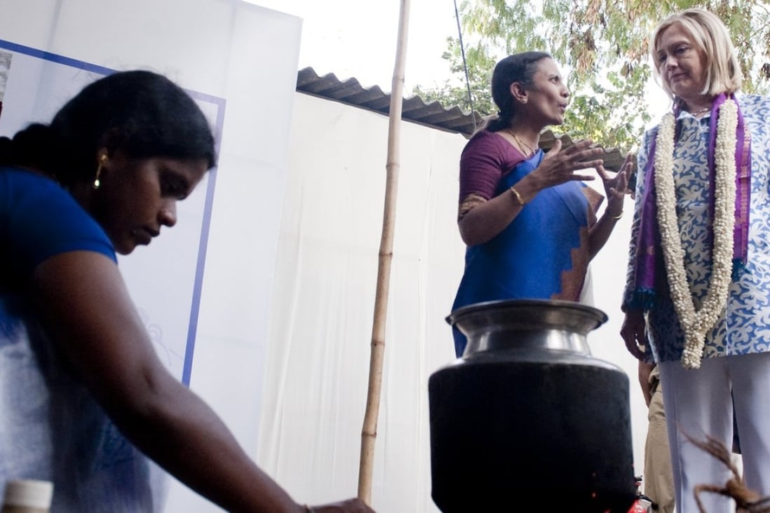 Former US Secretary of State Hillary Clinton at an exhibition of cook stoves alongside Dr. Kalpana Balakrishnan, a cook stove researcher, during a visit to Chennai in India on July 20, 2011. Clinton is a long-time advocate of using clean-burning cook stoves in kitchens, instead of more traditional stoves that burn wood or solid fuel releasing toxic fumes into poorly ventilated cooking areas in many poor regions around the world, a problem mainly affecting women and small children. Photo: Agence France-Presse