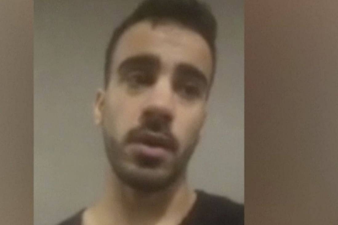 In this Thursday, November 29, 2018, image from video, Hakeem Al-Araibi speaks at Bangkok International Airport, Thailand. Australian officials raised with Thai authorities the plight of the Australia-based refugee professional soccer player who was detained in Bangkok and fears deportation to his native Bahrain, Australia's foreign minister said Friday, November 30, 2018. Rights groups are urging Thai authorities not to deport Al-Araibi to his homeland, where he faces imprisonment for what his supporters say are political reasons. Al-Araibi was detained at the airport on Tuesday. (SBS via AP)