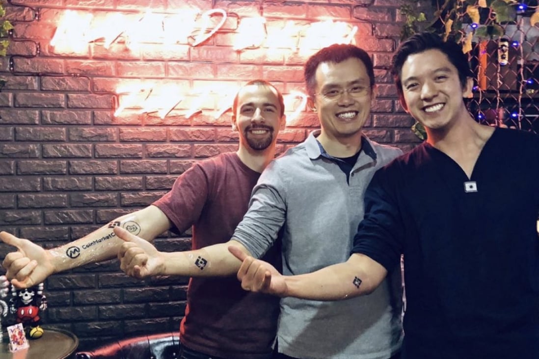 Luke Wagman of CoinMarketCap (left), Binance founder Zhao Changpeng (centre) and blockchain investor Gareth Lai show off their tattoos. Photo: Medium