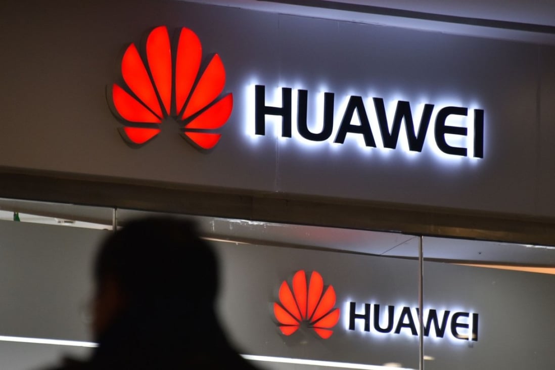 A man walks past a Huawei store in Beijing on December 10, 2018. Photo: AFP