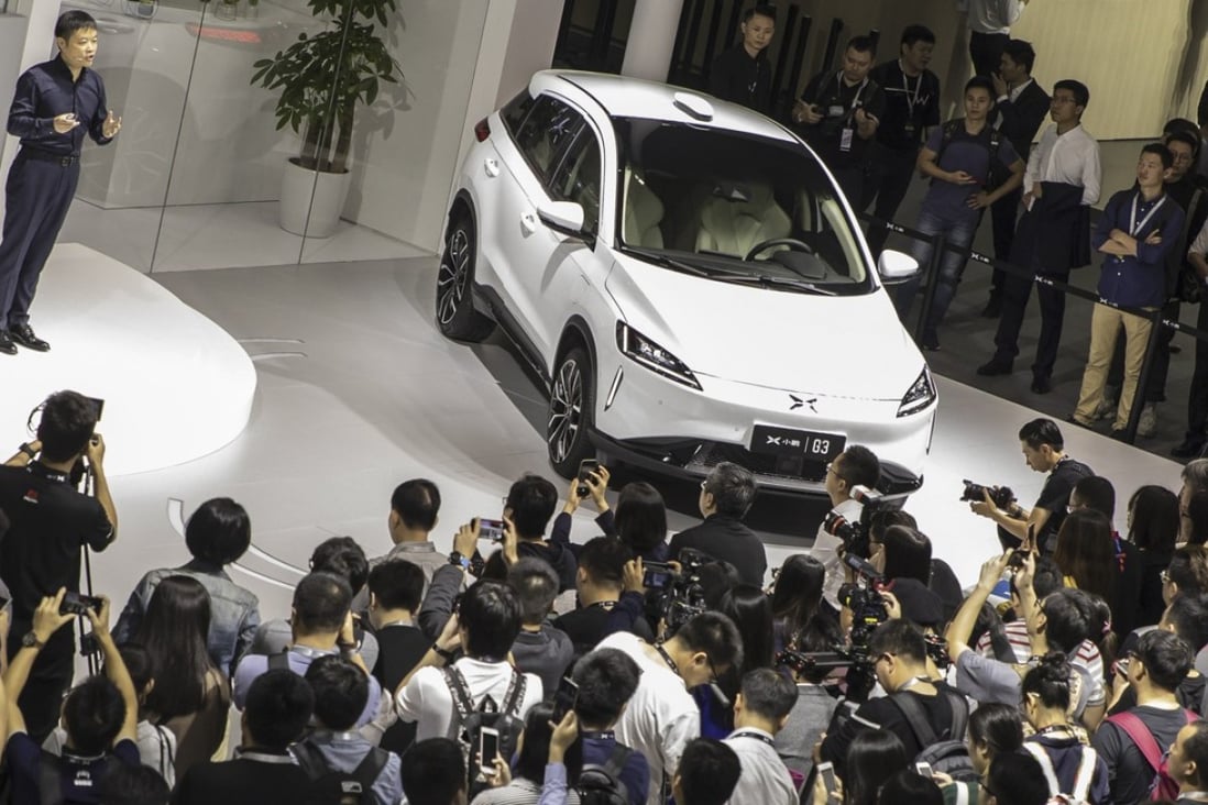 He Xiaopeng, chairman and co-founder of Xpeng Motors Technology Ltd., speaks as he stands next to the company's G3 electric sport utility vehicle (SUV) at the Guangzhou International Automobile Exhibition in Guangzhou, China, on Friday, Nov. 16, 2018. Photo: Bloomberg