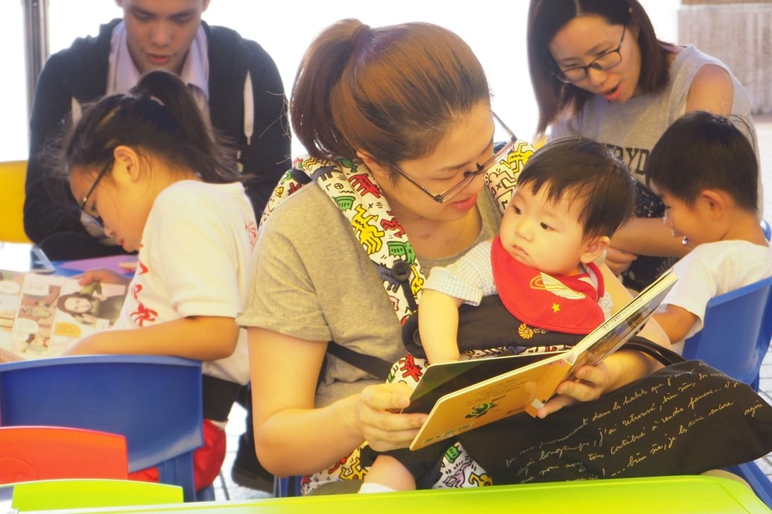 A mother reads to her baby son at the at pop-up library initiative held in Tuen Mun Cultural Square in November, as part of efforts to encourage Hongkongers to read more.