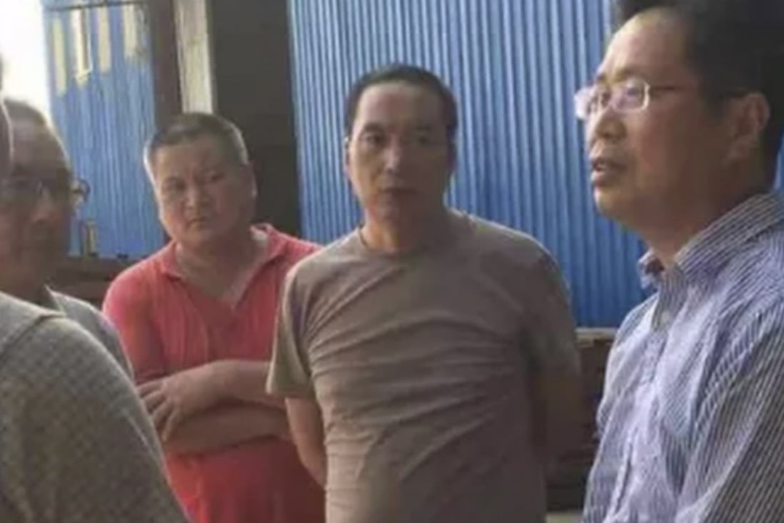Chinese embassy officials pictured at the factory. They have urged police to step up their investigations. Photo: weixin.qq.com