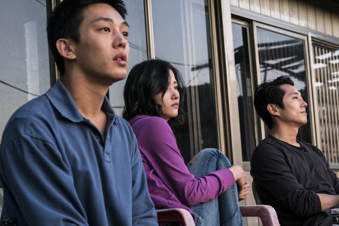 From left: Yoo Ah-in, Jun Jong-seo and Steven Yeun in a still from Burning.