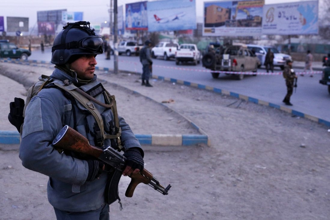 Afghan security officials stand guard at the scene of a car-bomb attack in Kabul, Afghanistan on Monday. Photo: EPA-EFE