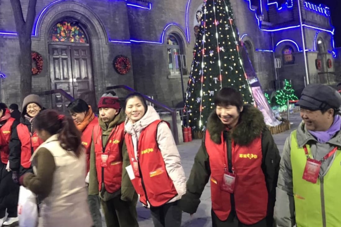 Volunteers welcome visitors to a Christmas Eve service at Asbury Church in Beijing. Photo: Liu Zhen