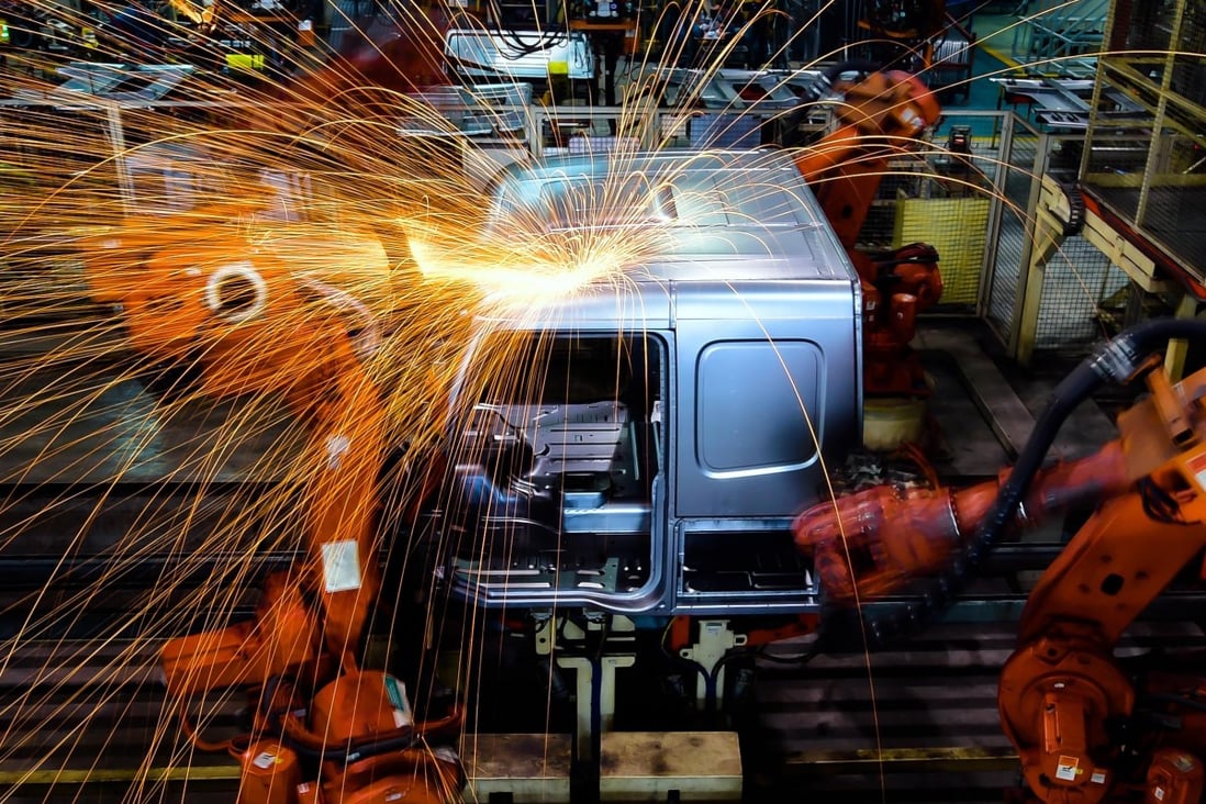 A robot welds parts at the Jinan Truck Company of the China National Heavy Duty Truck Group in Jinan. Photo: Xinhua