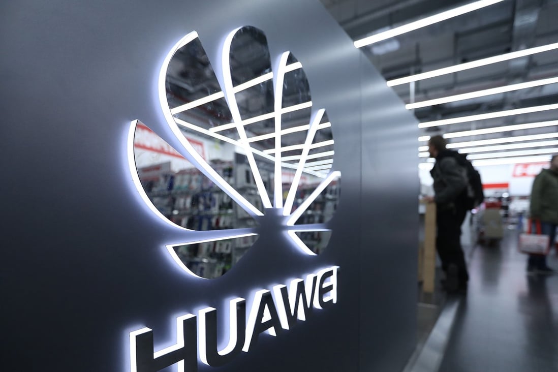 A Huawei Technologies logo sits on display as customers browse inside a Media Markt electronic goods store, operated by Ceconomy AG, in Berlin, Germany, on Monday, Dec. 17, 2018. Photo: Bloomberg