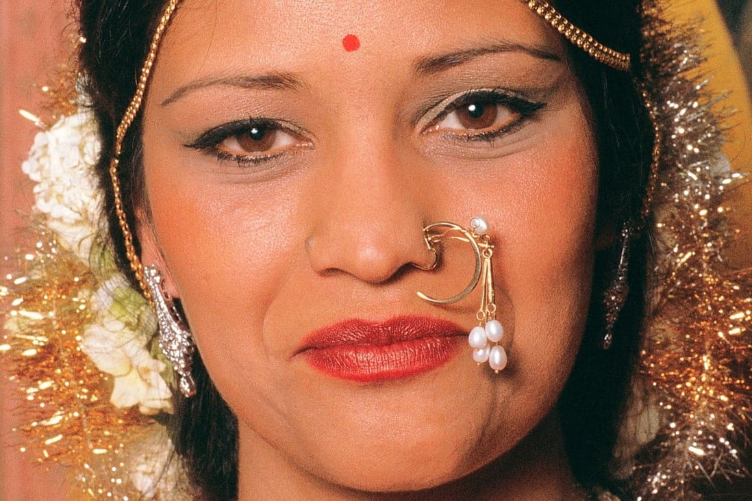 An Indian bride wears nose jewellery. Hindus have a piercing on the left side of the nose in honour of the marriage goddess, Parvati. Photo: Alamy