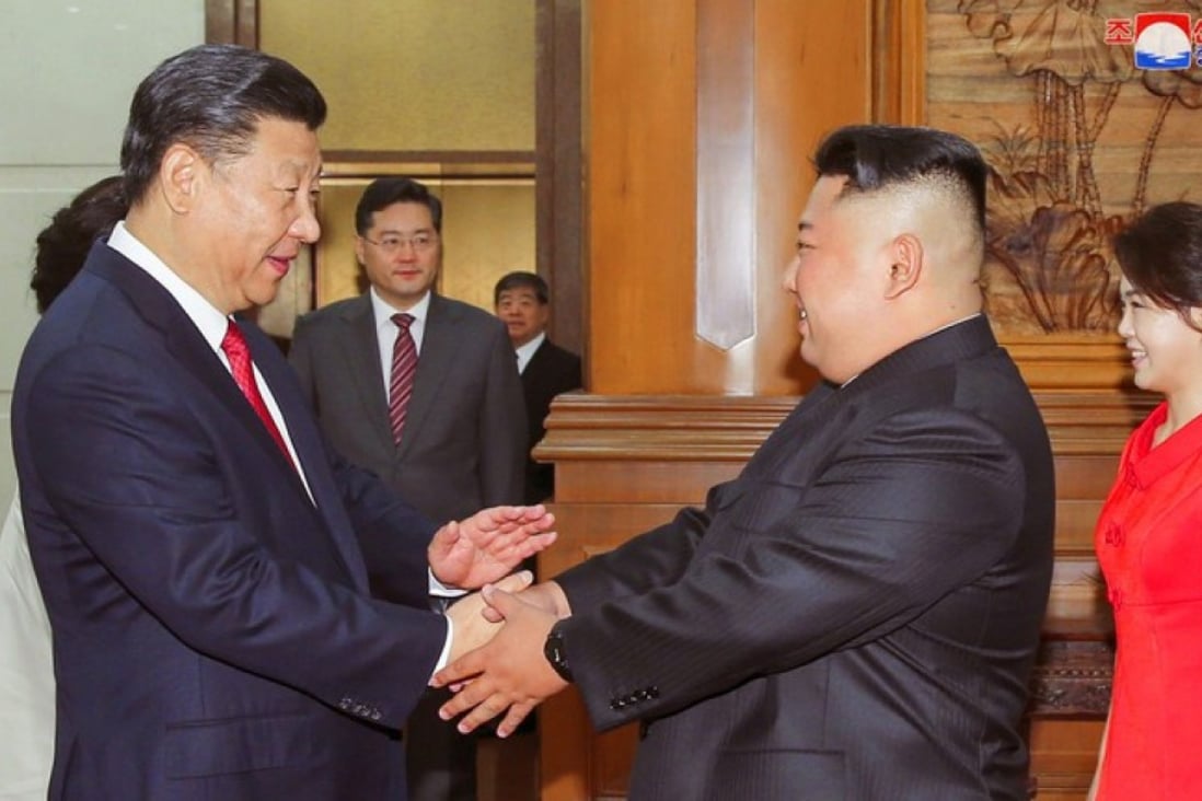 Chinese President Xi Jinping shakes hands with North Korean leader Kim Jong-un in Beijing in this undated photo released June 20, 2018. Photo: KCNA via Reuters