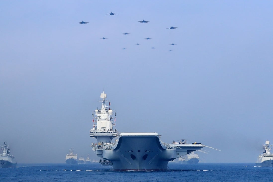 Warships and fighter jets of the Chinese People’s Liberation Army (PLA) Navy taking part in a military display in the South China Sea on April 12, 2018. Photo: Reuters