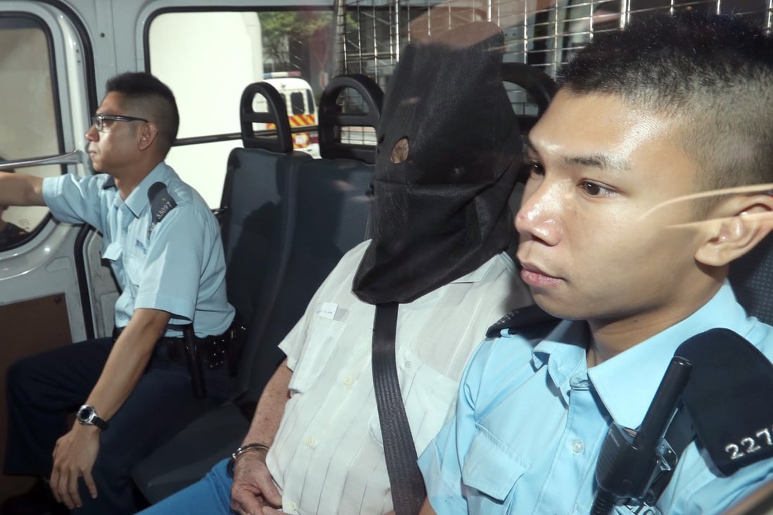 Wong Kok-man being escorted by officers in 2017. Photo: Edward Wong