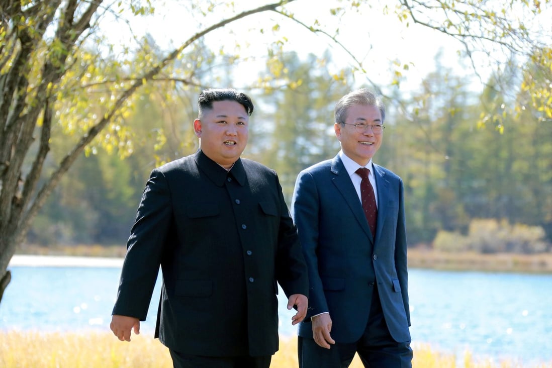 South Korean President Moon Jae-in and North Korean leader Kim Jong-un walk during a luncheon, in this photo released by North Korea's Korean Central News Agency (KCNA) on September 21, 2018. Photo: Reuters
