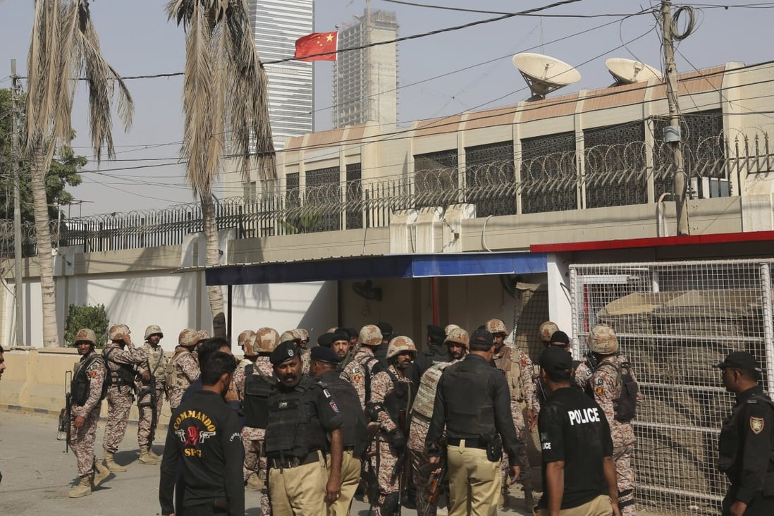 Pakistani security personnel in the compound of the Chinese consulate in Karachi on November 23. Five suspects have been arrested over the attack. Photo: AP