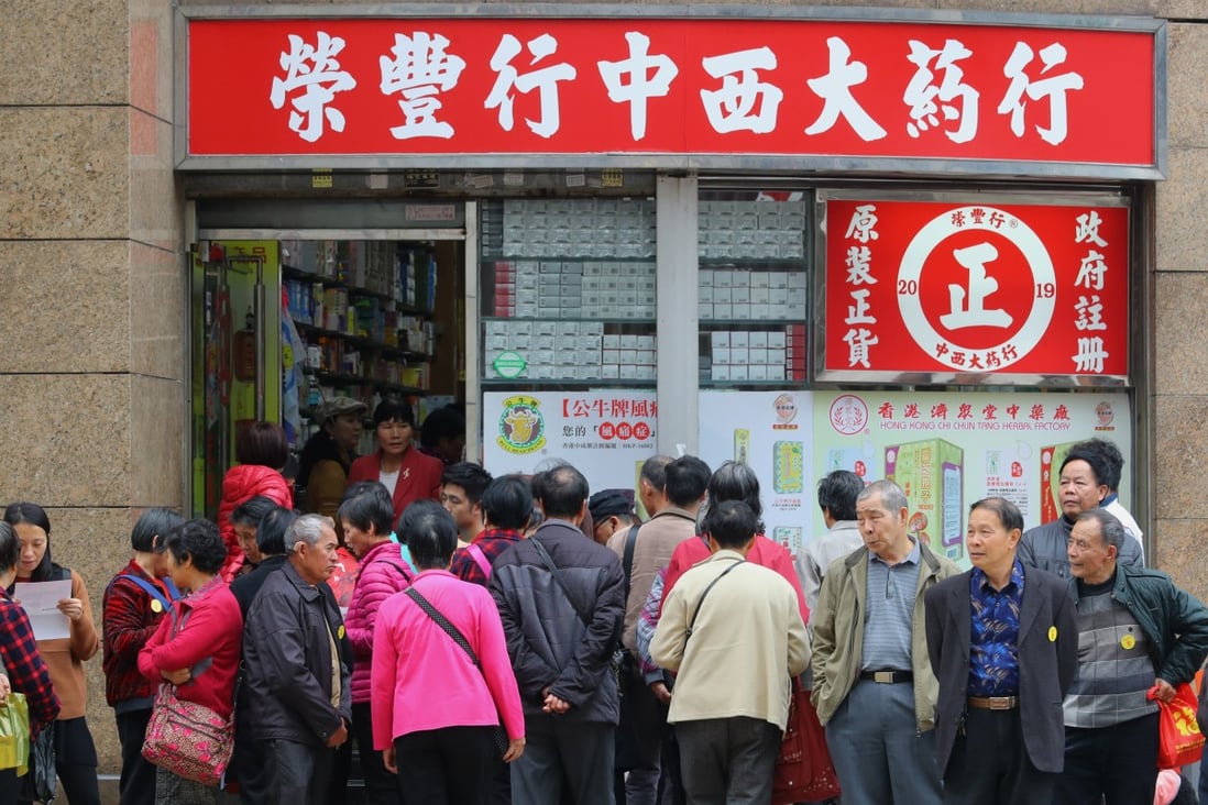 Tourists from mainland China crowd around a store on Bailey Street, in Hung Hom. Photo: Edmond So