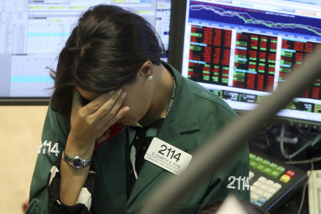 A specialist with Lehman Brothers reacts as the firm slides into bankruptcy in 2008. Photo: AP