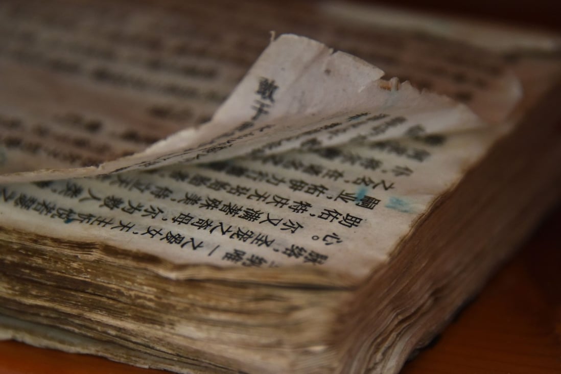 A worn Bible is seen at the new government-sanctioned Catholic cathedral in Xincun, Henan province on August 12, 2018. Photo: AFP