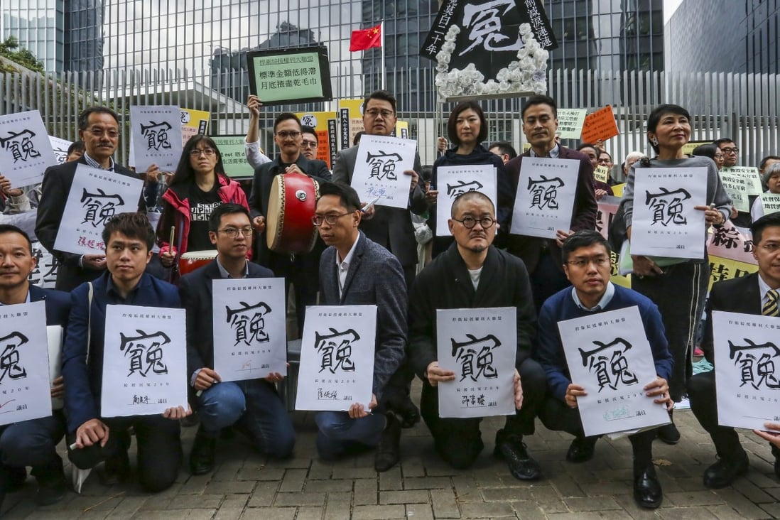 CSSA (Comprehensive Social Security Assistance) Rights Defence and a group of elderly protest against raising the age threshold for the programme at the central government offices in Tamar on Wednesday. Photo: Jonathan Wong/SCMP
