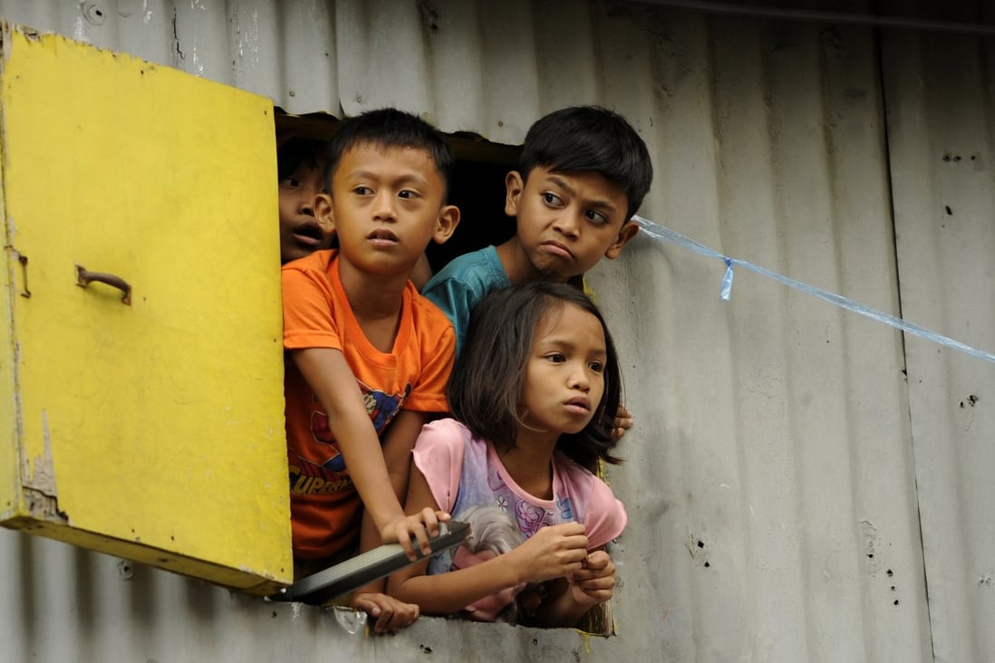 Children at a shanty town in Manila. Photo: AFP