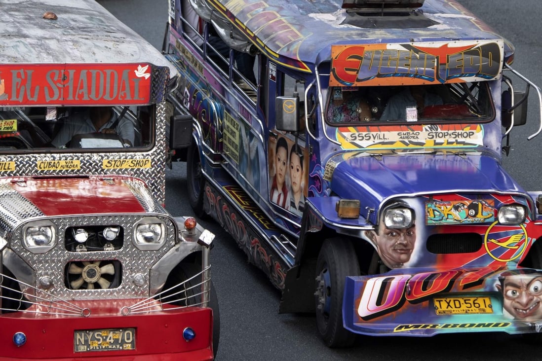 Hand-painting custom decor on jeepneys adorned with images of everything from Batman to babies, as well as disco lights and chrome wheels, have for decades provided cheap transport for millions. But pollution and safety concerns have led to a modernisation programme, with jeepneys 15 years or older to be taken off the streets by 2020. Photo: AFP