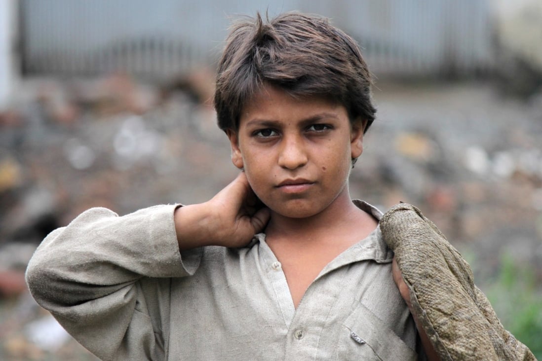 Hassan Khan, 7, who collects scraps including hair on the outskirts of Islamabad. Photo: Haroon Janjua