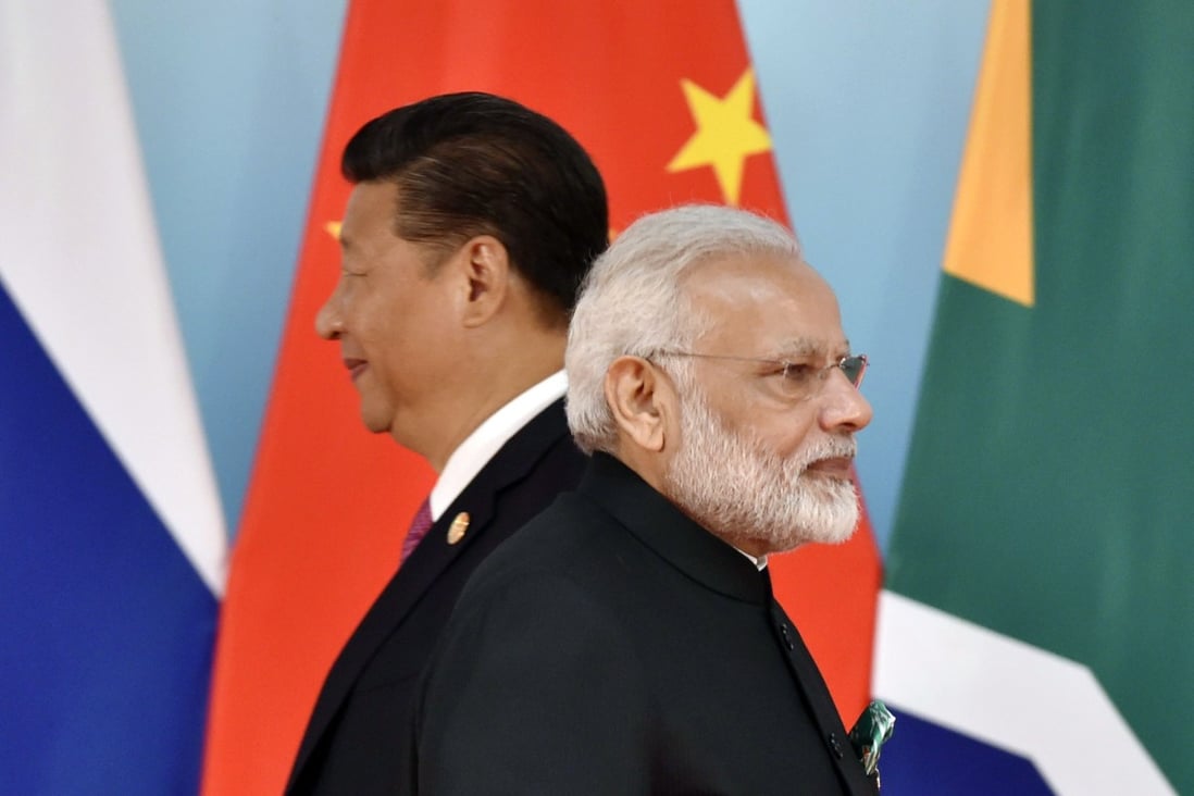 Indian Prime Minister Narendra Modi (right) and Chinese President Xi Jinping (left) attend the group photo session during the BRICS Summit at the Xiamen International Conference and Exhibition Centre in Xiamen on September 4, 2017. Photo: Agence France-Presse