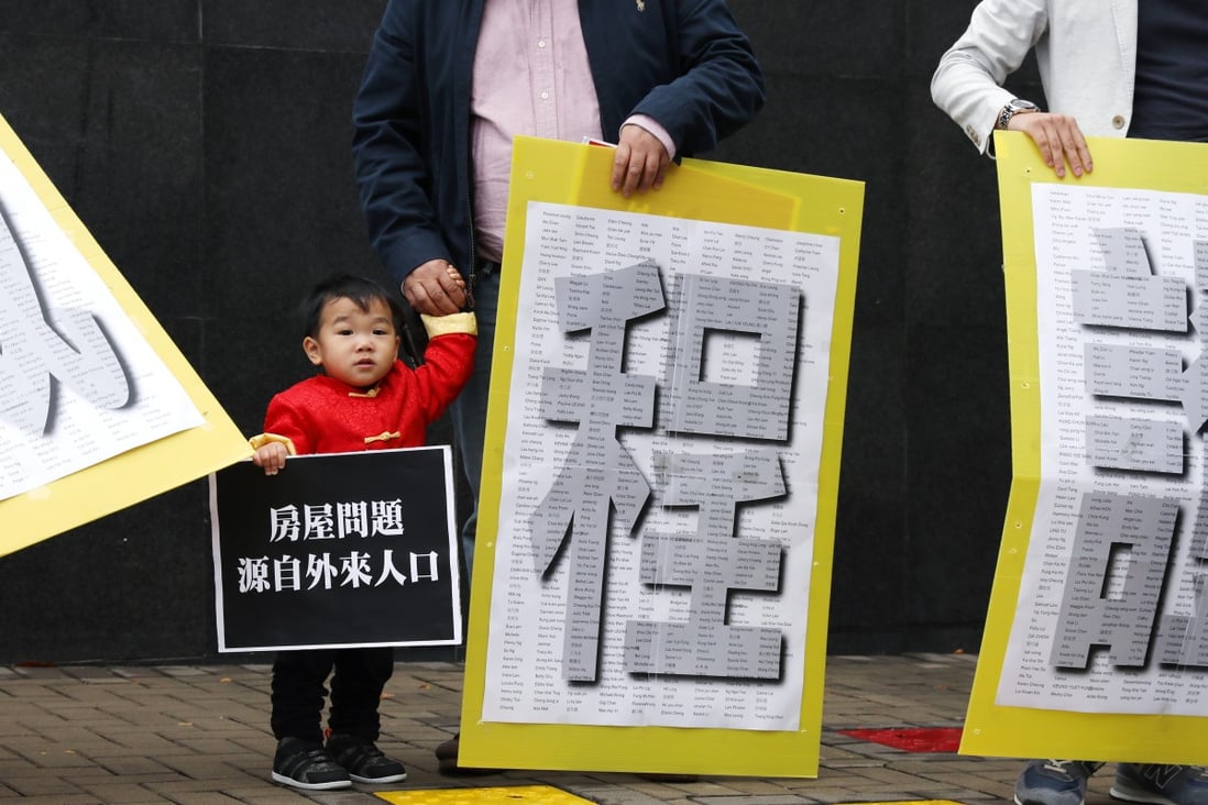 A protester brings along a child as localists and doctors voice opposition to a migrant scheme that they say is contributing to overcrowded hospitals. Photo: Nora Tam
