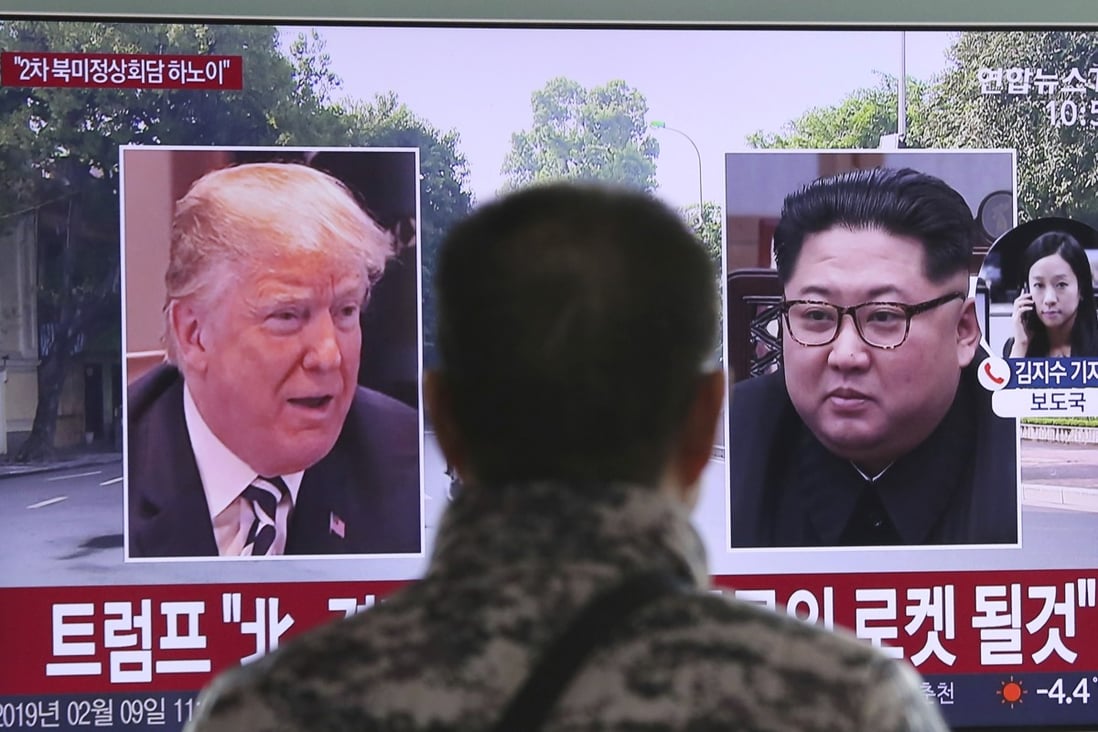 A man watches a TV screen showing images of US President Donald Trump and North Korean leader Kim Jong-un during a news program at the Seoul Railway Station on February 9. Photo: AP