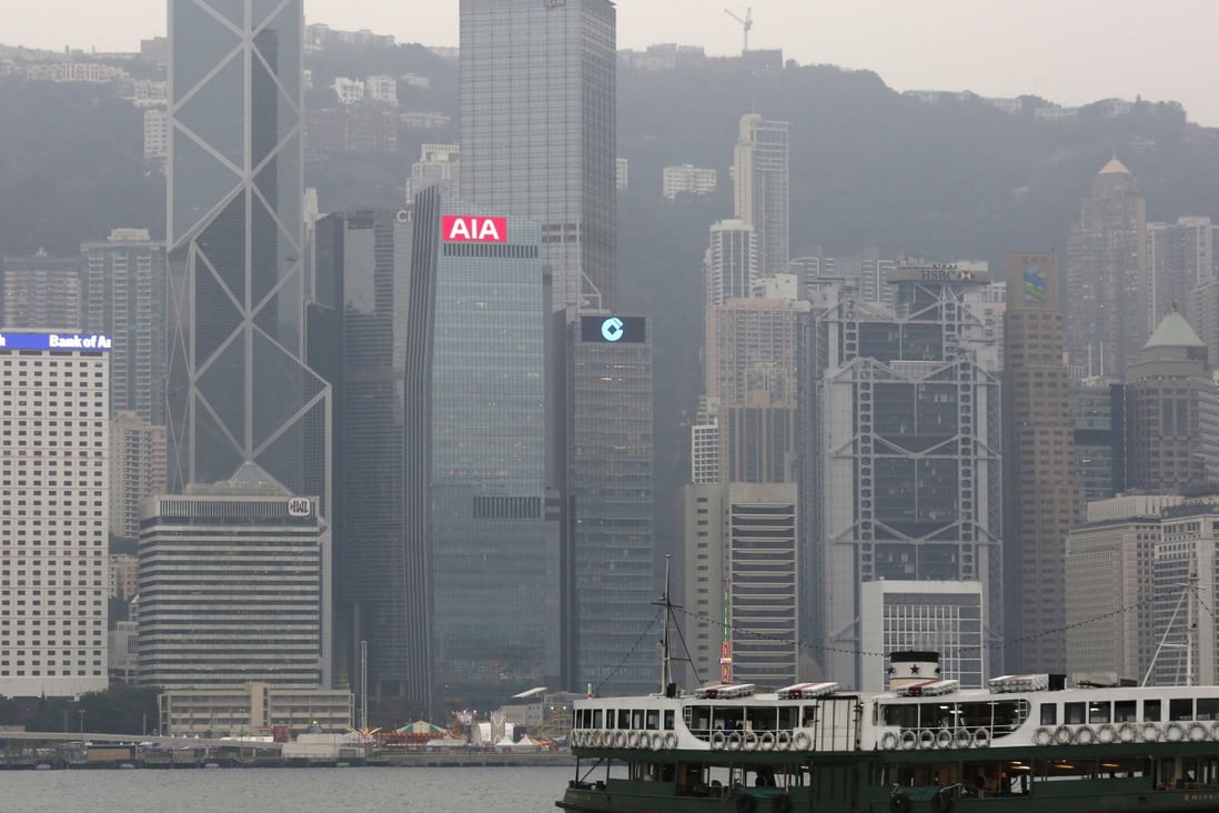 A ferry sails across Victoria Harbour in front of Hong Kong’s main financial district. Banks and insurers have a lot to gain from the ‘Greater Bay Area’, say analysts. Photo: Reuters