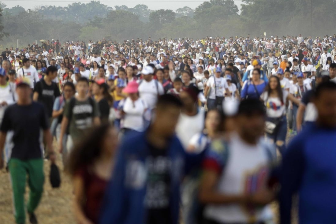 People begin to arrive to the Venezuela Live Aid concert on the Colombian side of the Tienditas International Bridge on the outskirts of Cucuta, Colombia, on the border with Venezuela. Photo: AP Photo