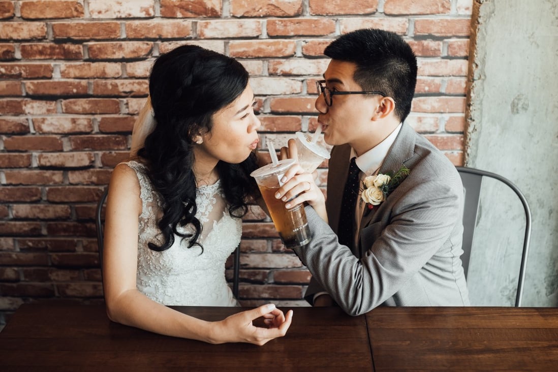 Christopher Cheung enjoys a bubble tea with his wife on his wedding day.