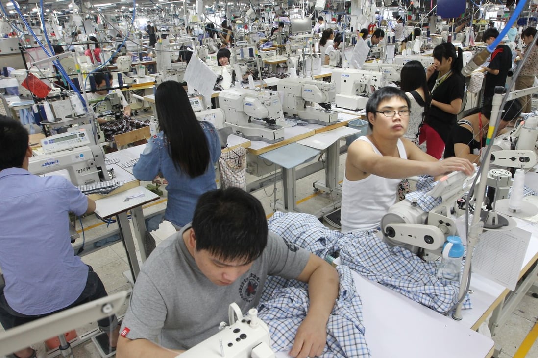 Staff on a shirt production line at a textile factory in Dongguan, Guangdong. Young migrant workers are increasingly looking to the services sector for jobs. Photo: Edward Wong