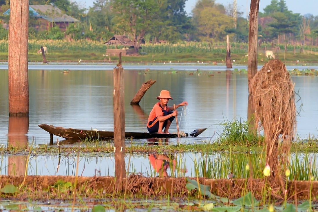 A Cambodian fisherman lays his nets out on Ta Mok Lake in Anlong Veng, Cambodia. Photo: AFP