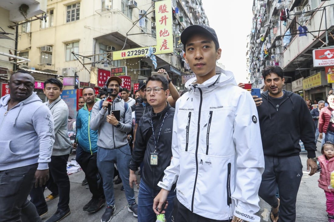 Wong Ching-kit is suspected of being behind a stunt that saw banknotes being thrown from the top of a building in Sham Shui Po in December. Photo: Dickson Lee