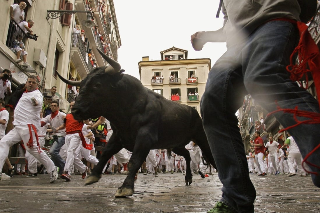 The running of the bulls is shown at the San Fermin fiestas in Pamplona in northern Spain on July 8, 2012. China’s bull market began quickly, raising questions about how long it can last. Photo: Associated Press
