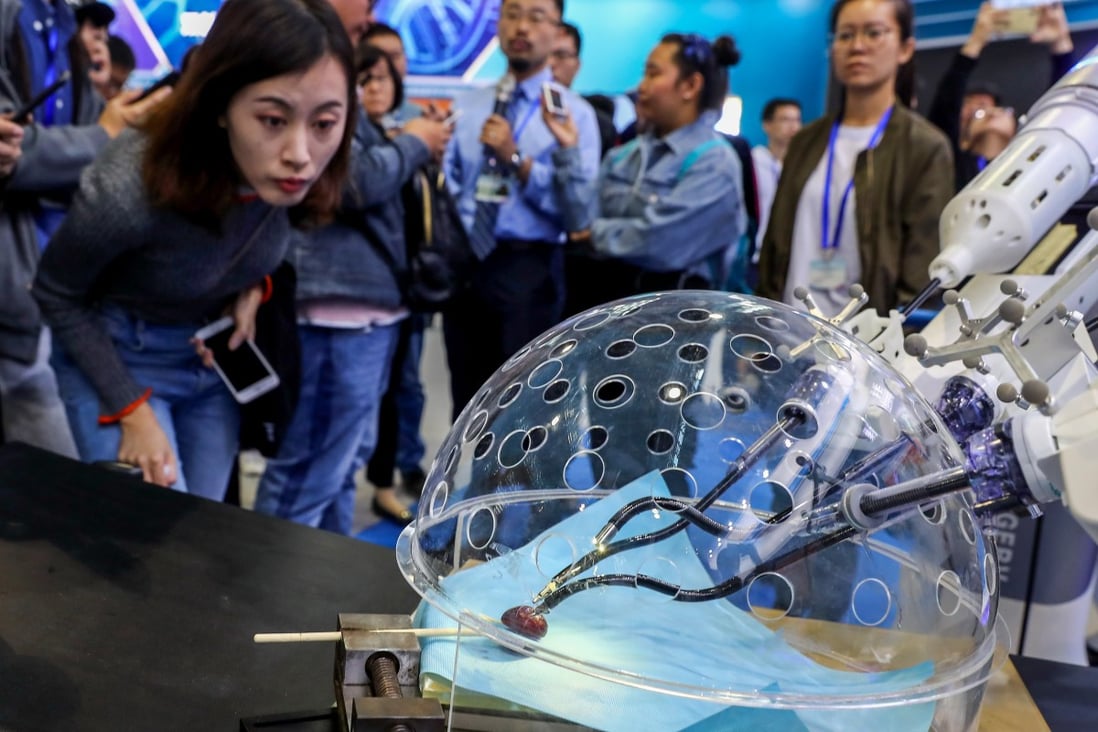 A porotic laparoscopic surgery robot system at a press preview of the 2018 National Mass Innovation and Entrepreneurship Week in Beijing on October 8, 2018. Photo Xinhua