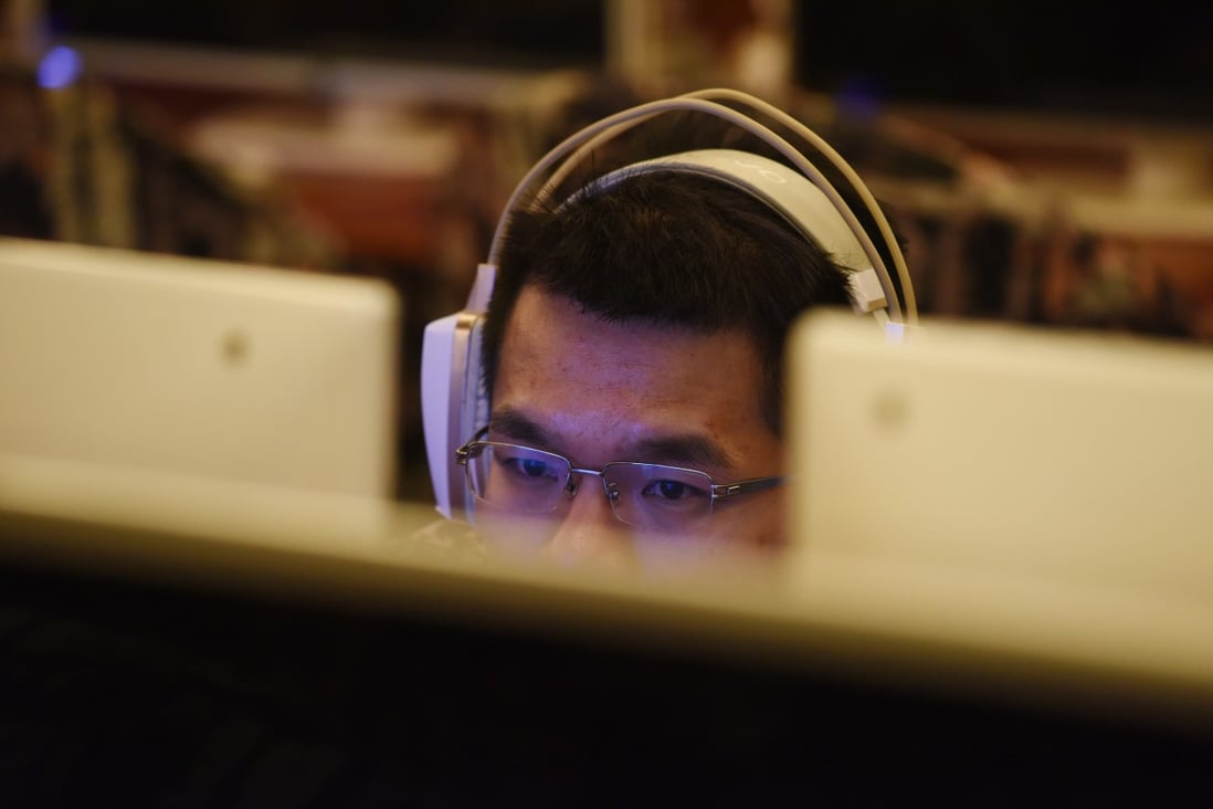 A man uses a computer in an internet cafe in Beijing. A large number of records in the leaked database contain the names and addresses of cybercafes. Photo: AFP