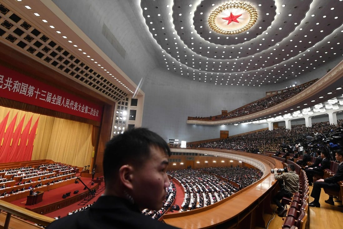 Premier Li Keqiang announced his government work report during the opening of the National People's Congress at the Great Hall of the People in Beijing. Photo: AFP