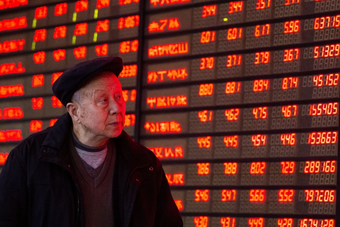 Interest in the China stock market has shot up since the major benchmarks have been on fire. Here, an investor recently looks at stock prices in Nanjing. In China, red signals gains. Photo: Xinhua