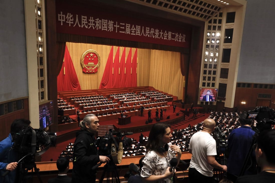 Premier Li Keqiang delivering the work reports at the opening session of the China's National People's Congress at the Great Hall of the People in Beijing. Photo: AP