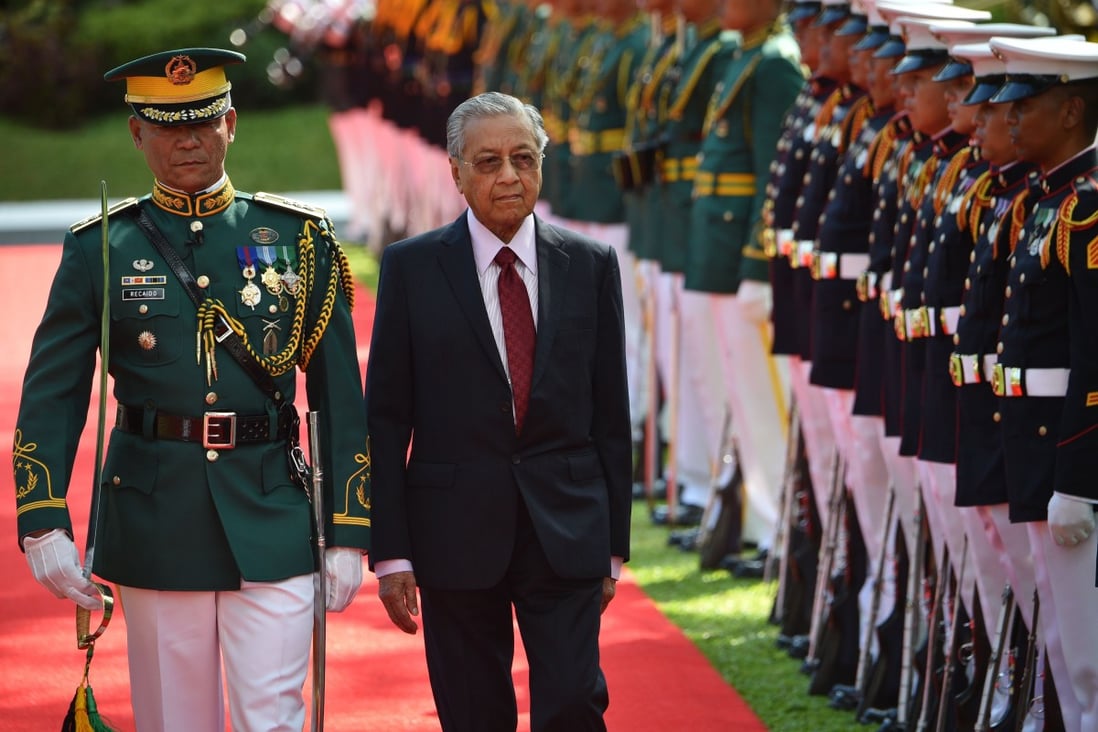 Malaysia's Prime Minister Mahathir Mohamad reviews an honour guard during a welcoming ceremony at the Malacanang Palace in Manila. He is in the Philippines for talks with President Rodrigo Duterte. Photo: AFP
