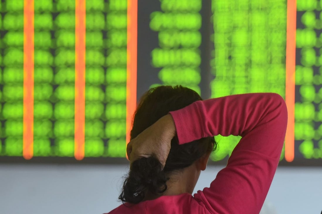 A investor monitors stock prices at a securities company in Hangzhou on October 18, 2018, which was a day of losses, which in China are signalled in green. In Photo: Agence France-Presse
