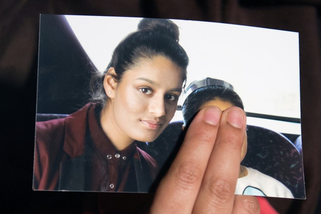 A photo of Shamima Begum is held up by her sister, Renu Begum, as she makes an appeal for her to return home in 2015. Photo: Reuters