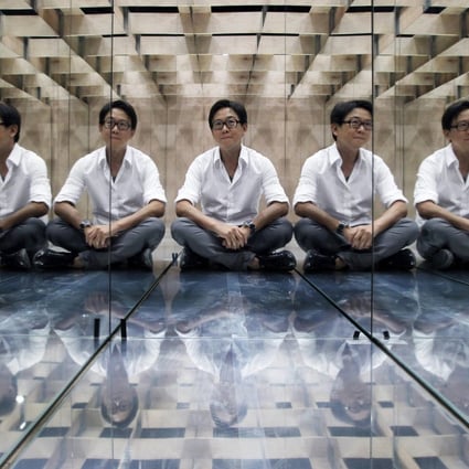 A multiplicity of William Lims is reflected inIllegal Entry, one of his installations on display at the "Space Journey" exhibition in Taikoo Place.Photo: Edward Wong
